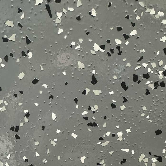 dark grey floor with black and white flakes - Innovative Garage Flooring partial flake epoxy flooring