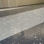 close up of a full flake epoxy floor with white and grey - Innovative Garage Flooring epoxy flooring contractors near