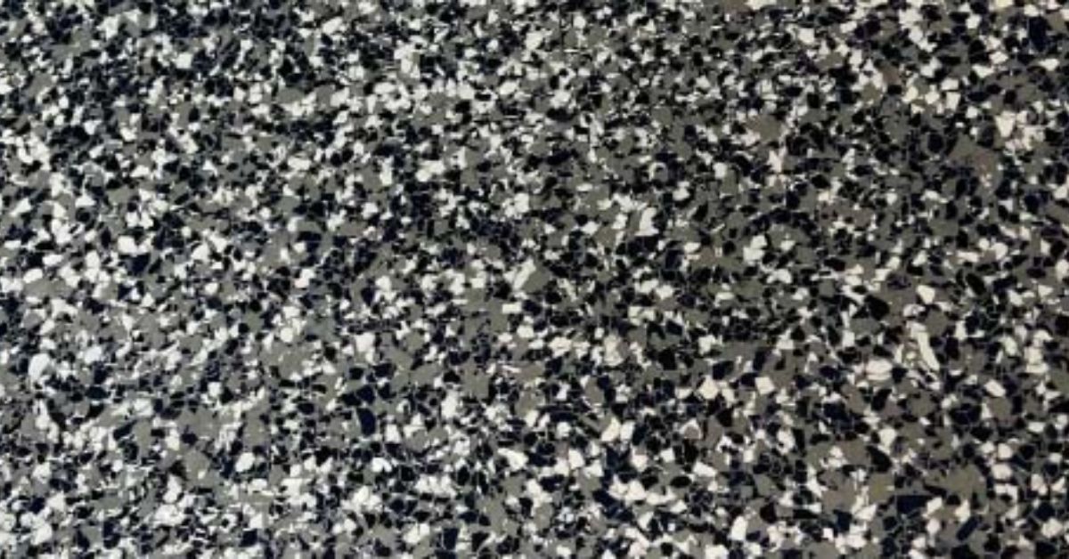 close up of a full flake epoxy floor with white and black - Innovative Garage Flooring epoxy flooring contractors near