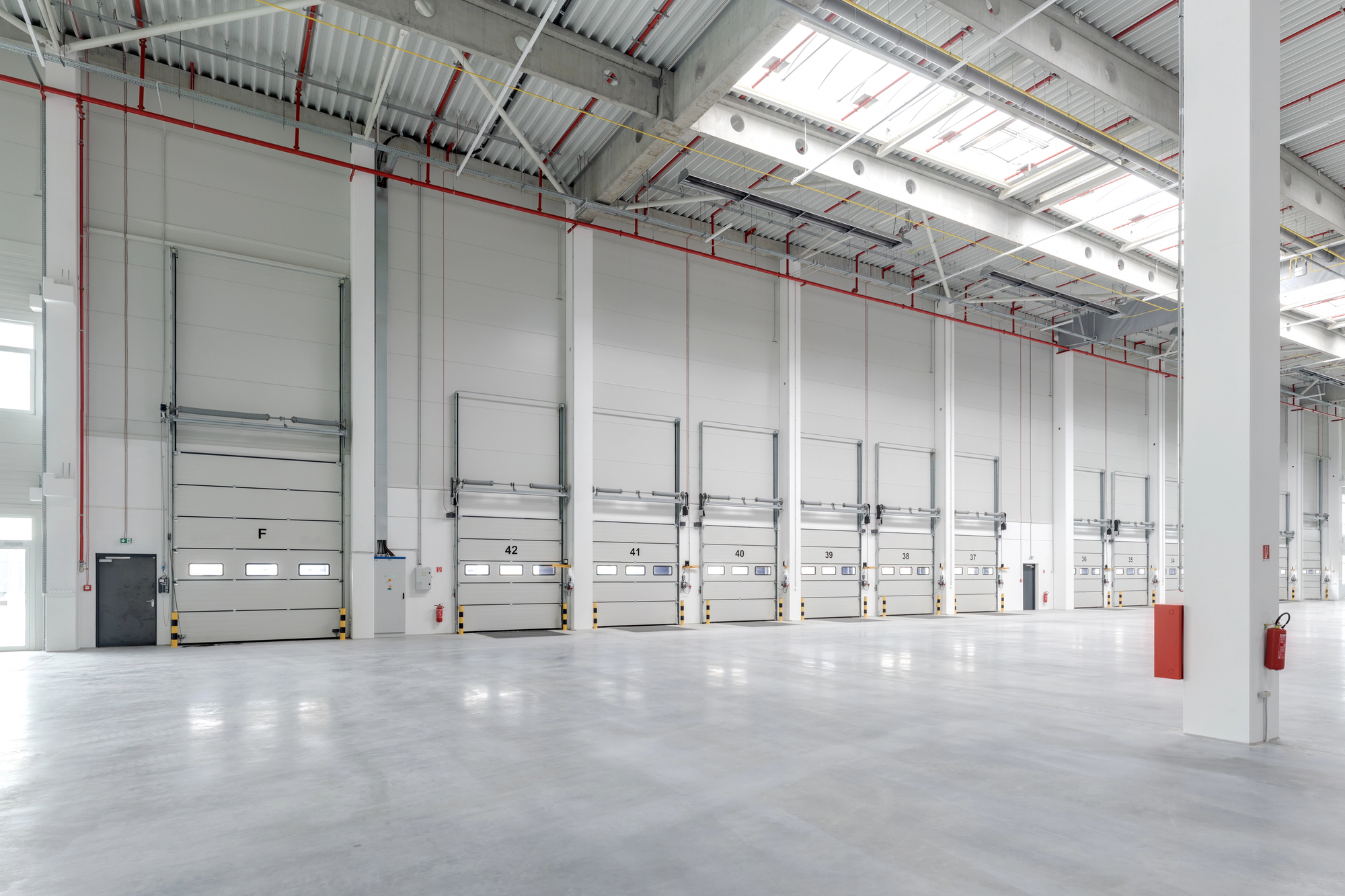 industrial facility with multiple closed garage doors - Innovative Garage Flooring commercial flooring