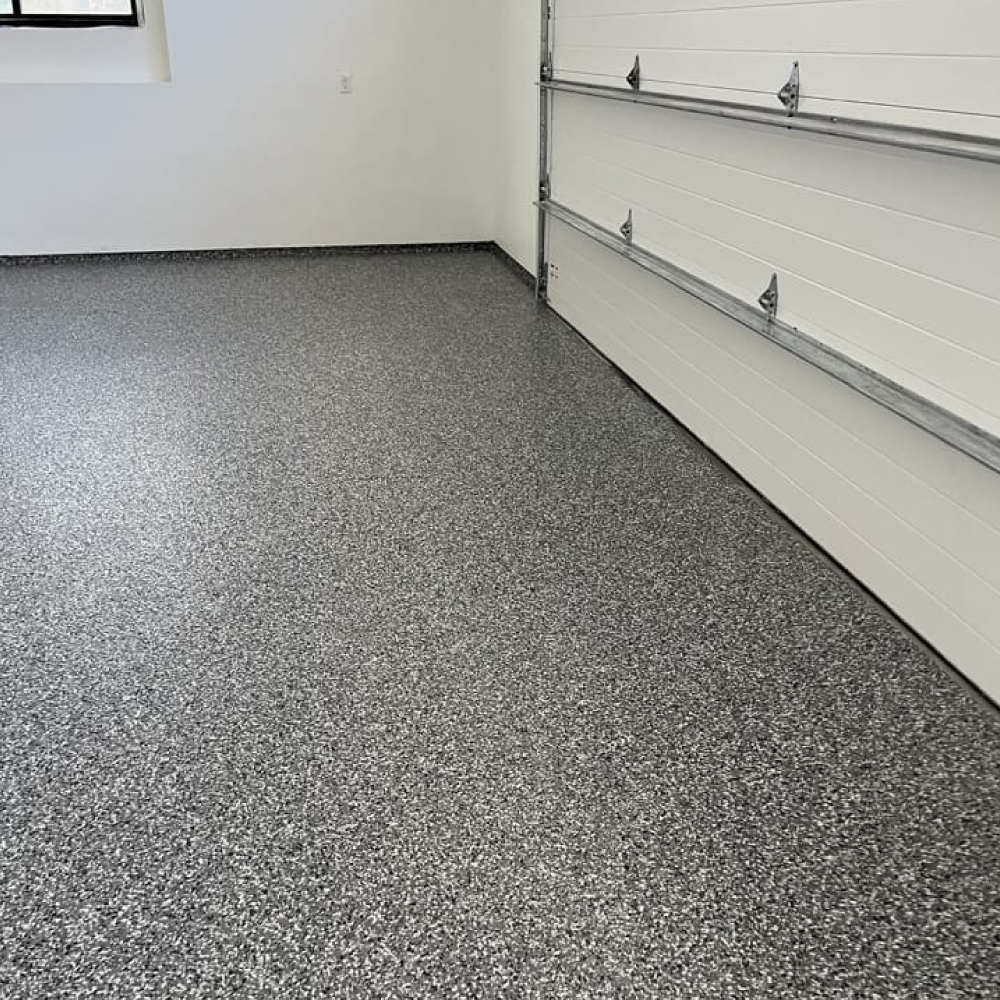 garage with closed door and full flake epoxy floors - Innovative Garage Flooring epoxy flooring