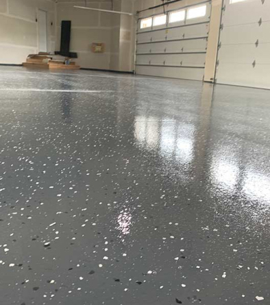 garage space with closed door - Innovative Garage Flooring partial flake epoxy