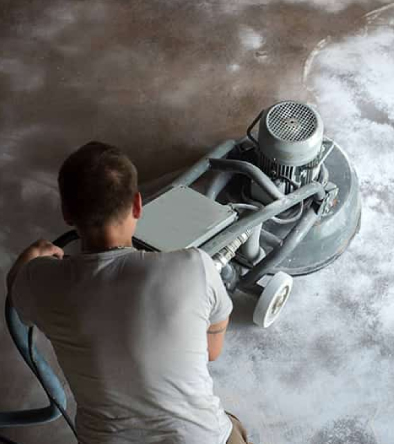 man polishing concrete floor - Innovative Garage Flooring polished concrete flooring