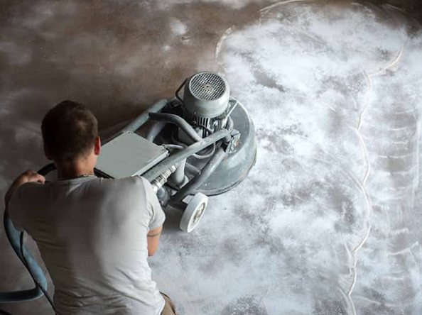 man polishing concrete floor - Innovative Garage Flooring polished concrete flooring