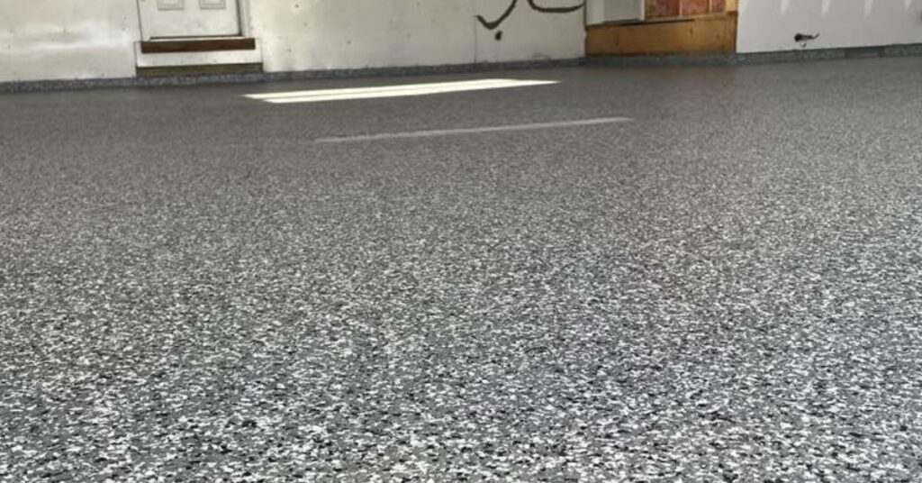 full flake epoxy flooring with blue and white flakes in a residential garage - Innovative Garage Flooring epoxy flooring