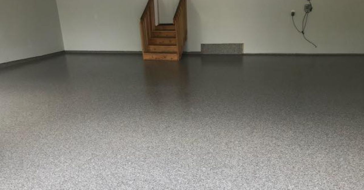 full flake epoxy flooring with a set of wood stairs - Innovative Garage Flooring epoxy flooring