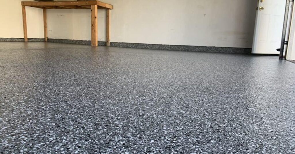 full flake epoxy flooring with a wood bench - Innovative Garage Flooring epoxy flooring contractors near