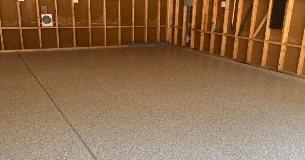 epoxy floor in a garage with wood stud walls - Innovative Garage Flooring epoxy flooring contractors near