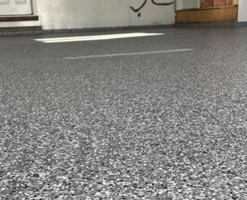 full flake epoxy flooring with blue and white flakes in a residential garage - Innovative Garage Flooring epoxy flooring