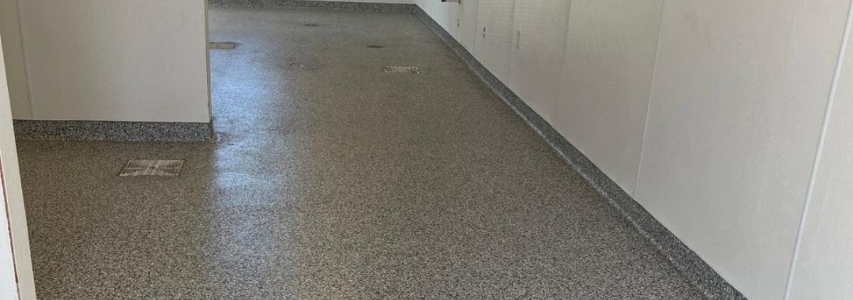 epoxy floor in an unfinished coffee shop - Innovative Garage Flooring epoxy flooring