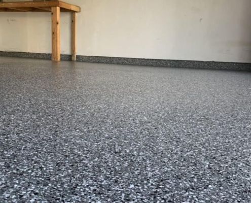 full flake epoxy flooring with a wood bench - Innovative Garage Flooring epoxy flooring contractors near