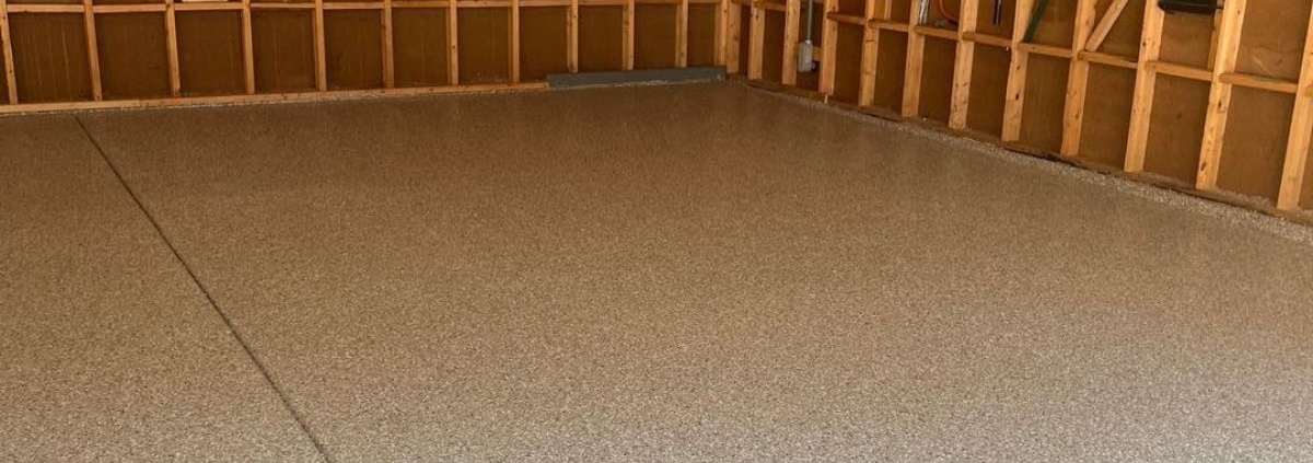 epoxy floor in a garage with wood stud walls - Innovative Garage Flooring epoxy flooring contractors near