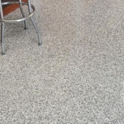 epoxy floor with a metal stool - Innovative Garage Flooring epoxy flooring contractors near