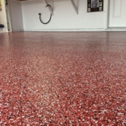 epoxy flooring with a red base and black and white flakes - Innovative Garage Flooring epoxy flooring contractor near