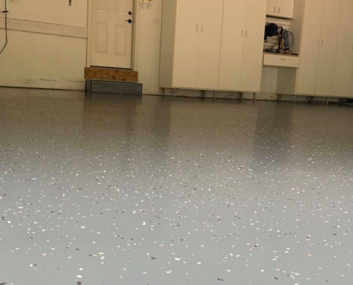 epoxy flooring with a grey base and white flakes - Innovative Garage Flooring epoxy flooring contractor near