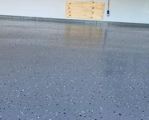 epoxy flooring with a blue base and white flakes - Innovative Garage Flooring epoxy flooring contractor near