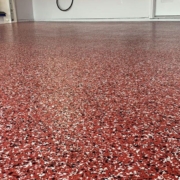 close up of full flake epoxy flooring with red flakes - Innovative Garage Flooring full flake epoxy flooring