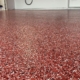 close up of full flake epoxy flooring with red flakes - Innovative Garage Flooring full flake epoxy flooring