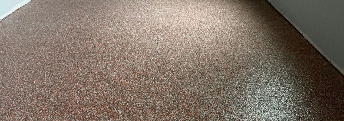 close up of full flake epoxy flooring with grey flakes - Innovative Garage Flooring full flake epoxy flooring