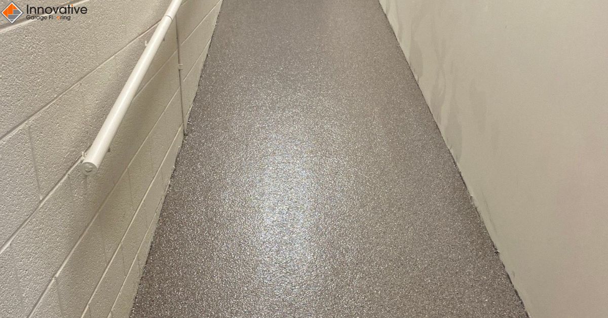 close up of full flake epoxy flooring with grey flakes - Innovative Garage Flooring full flake epoxy flooring