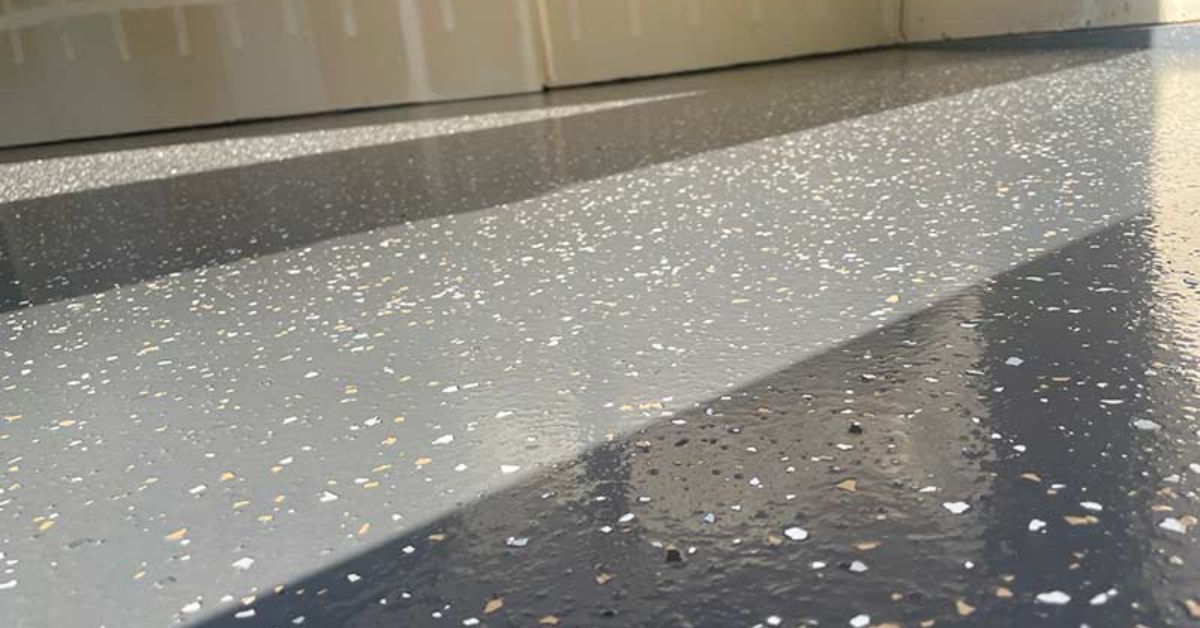 close up of grey epoxy flooring with white flakes - Innovative Garage Flooring epoxy flooring for architecture and design facilities